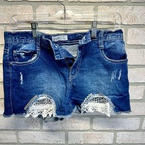 High-waisted blue shirts with white lace details on the front. Size 5/6.